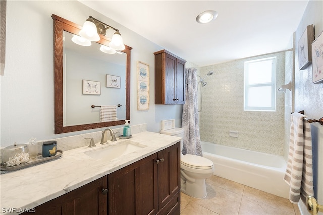 full bathroom with tiled shower / bath, toilet, tile flooring, and vanity