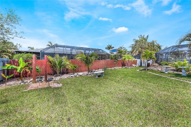 view of yard featuring glass enclosure