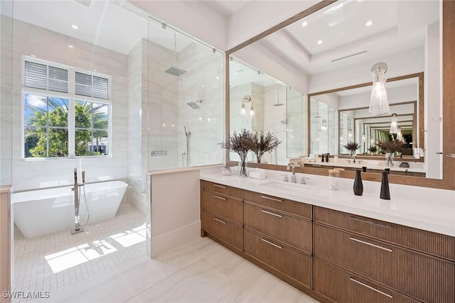 full bathroom with recessed lighting, vanity, a freestanding bath, marble finish floor, and a shower stall