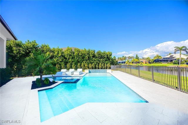 view of pool with a hot tub, a fenced in pool, a fenced backyard, a water view, and a patio area