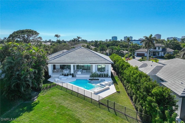 view of pool with a fenced backyard, a lawn, a fenced in pool, and a patio