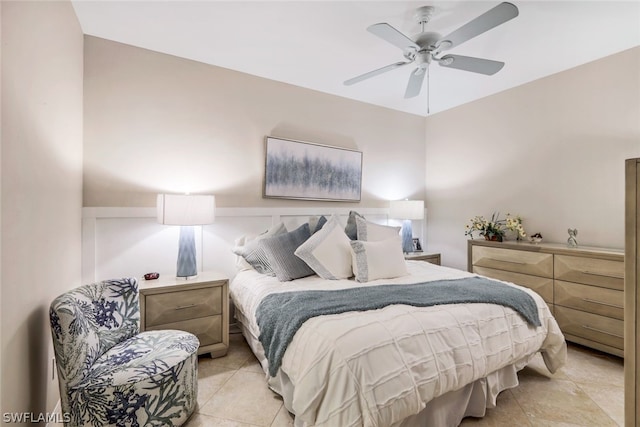 bedroom featuring light tile floors and ceiling fan