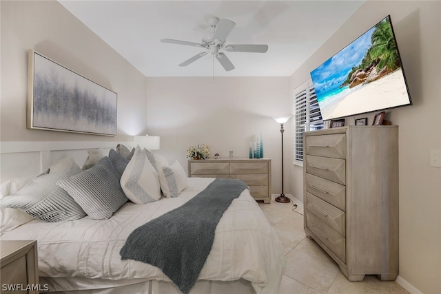 bedroom featuring ceiling fan and light tile floors