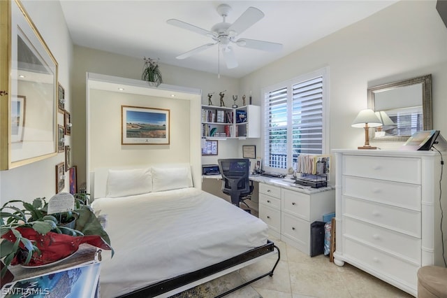 tiled bedroom featuring ceiling fan