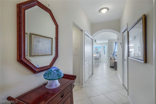 hallway featuring light tile floors