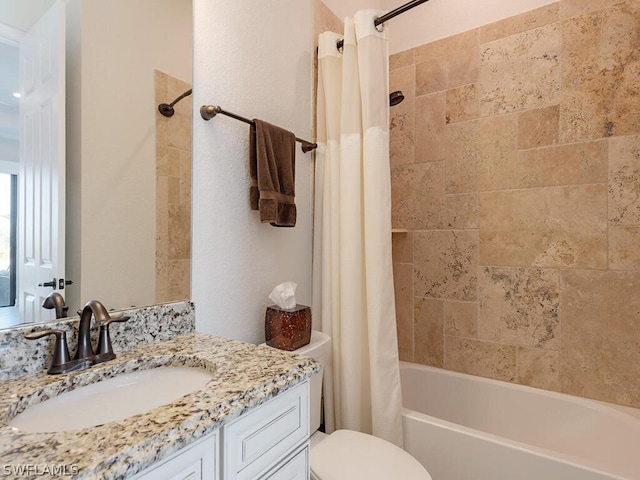 full bathroom featuring toilet, vanity, and shower / tub combo