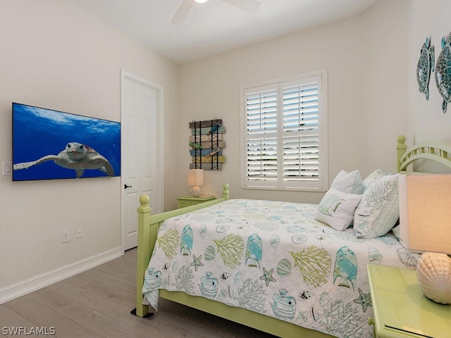 bedroom featuring ceiling fan and wood-type flooring