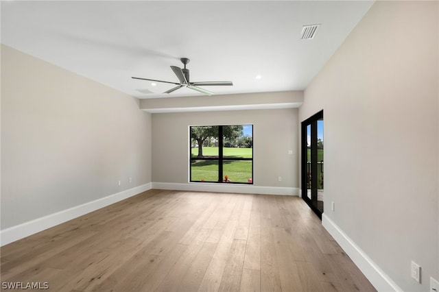 unfurnished room featuring ceiling fan and light wood-type flooring