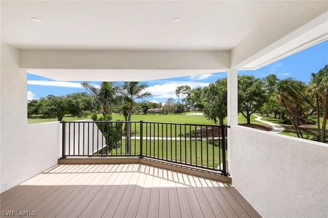 wooden deck with a yard