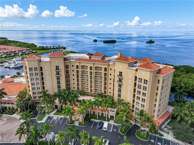 birds eye view of property with a water view