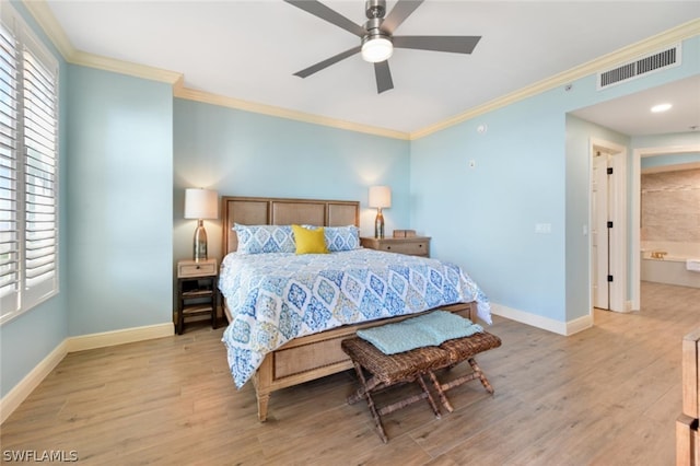 bedroom featuring ornamental molding, ensuite bath, ceiling fan, and light wood-type flooring