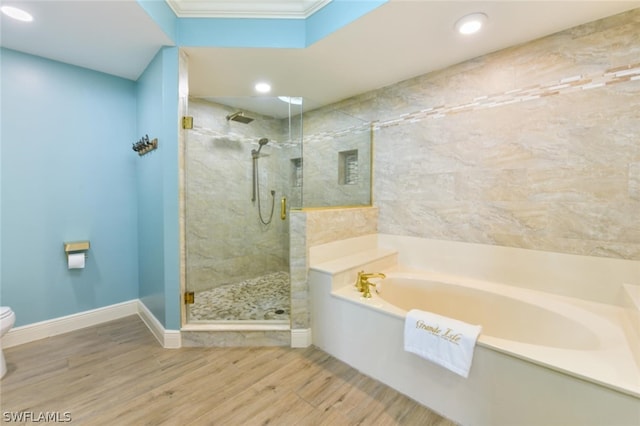 bathroom with toilet, separate shower and tub, hardwood / wood-style flooring, and crown molding