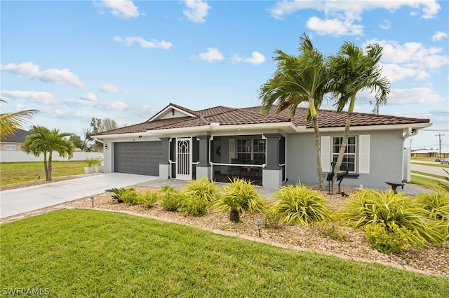 view of front facade featuring a front yard, a garage, and a sunroom