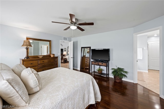 bedroom with dark hardwood / wood-style floors and ceiling fan