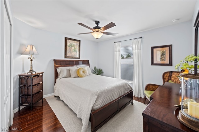 bedroom featuring dark hardwood / wood-style flooring, a closet, and ceiling fan