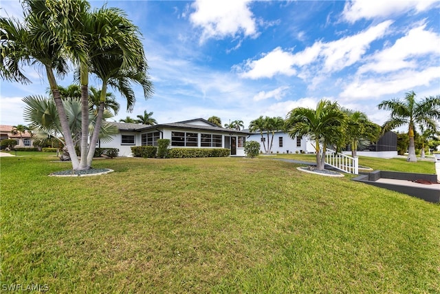 ranch-style house featuring a front lawn