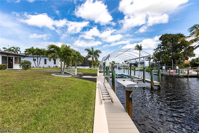 view of dock featuring a lawn and a water view