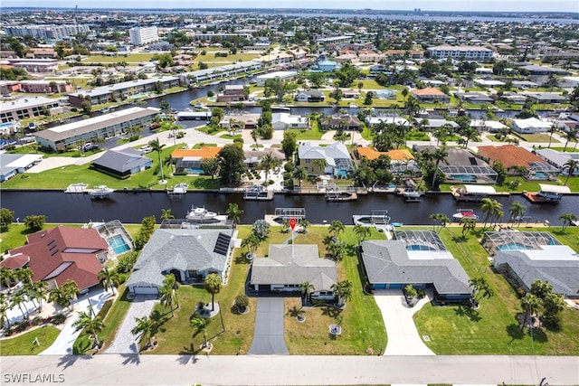 birds eye view of property featuring a water view