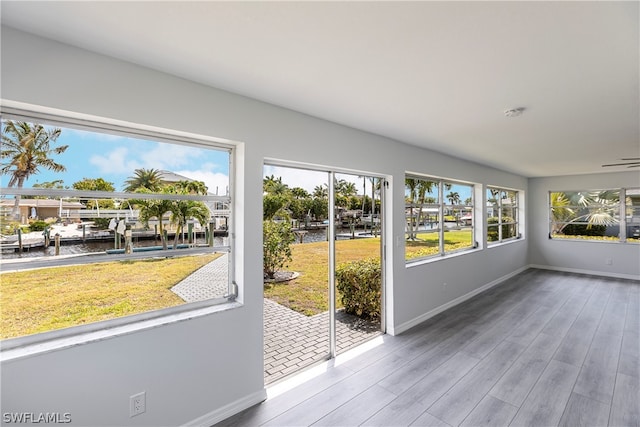 unfurnished sunroom featuring plenty of natural light