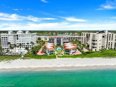 bird's eye view featuring a beach view and a water view