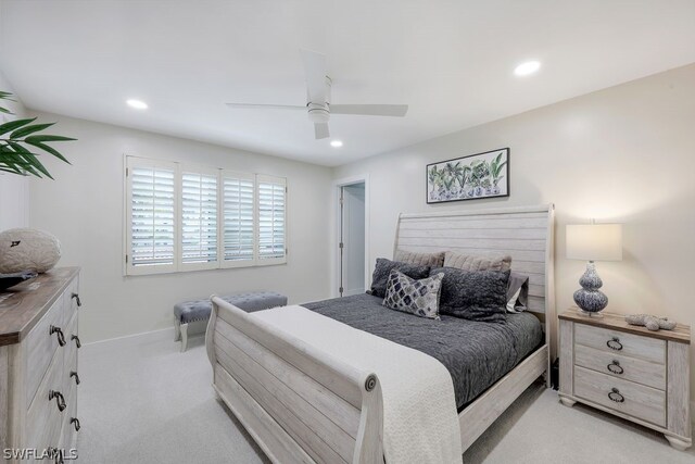 bedroom featuring light colored carpet and ceiling fan