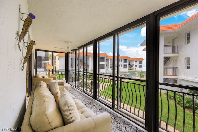 sunroom / solarium with ceiling fan