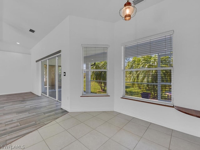 unfurnished room with light wood-type flooring