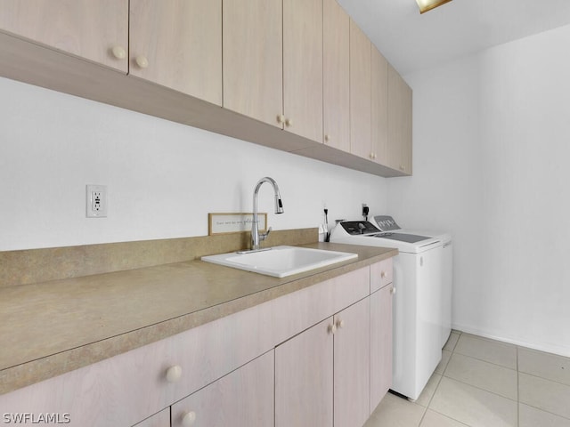 washroom with cabinets, independent washer and dryer, electric dryer hookup, sink, and light tile floors