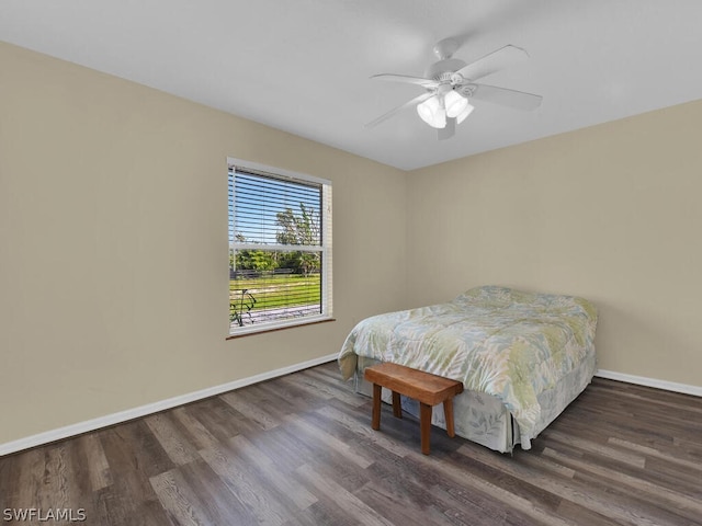 bedroom featuring ceiling fan and dark hardwood / wood-style flooring