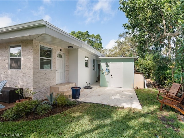 exterior space featuring central AC unit and a yard