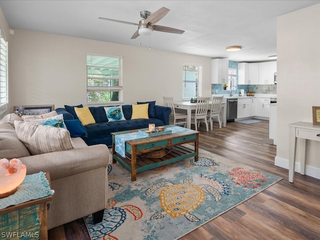 living room featuring sink, ceiling fan, and hardwood / wood-style floors