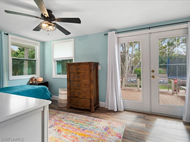 bedroom with french doors, ceiling fan, and light wood-type flooring