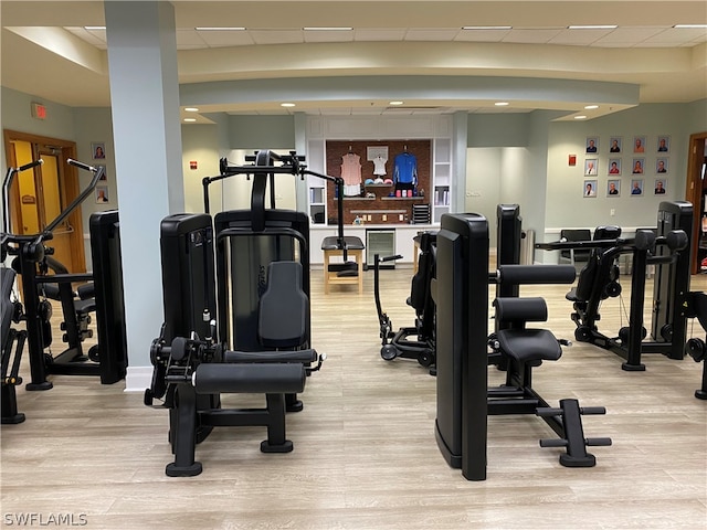 exercise room featuring light hardwood / wood-style flooring