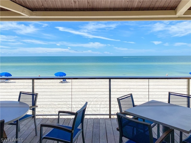 wooden deck featuring a water view