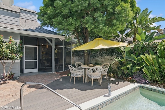 deck with a sunroom