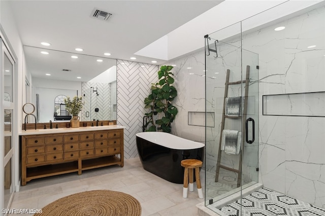 bathroom featuring vanity, separate shower and tub, and tile walls