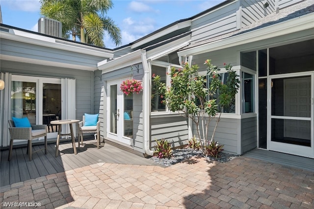 view of patio / terrace with cooling unit and a wooden deck