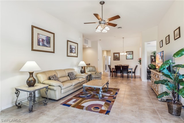 tiled living room with ceiling fan