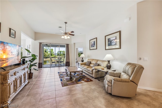 tiled living room with ceiling fan