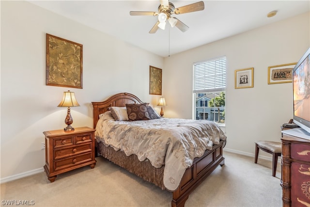 bedroom with light carpet and ceiling fan