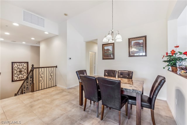 dining area with a notable chandelier and light tile floors