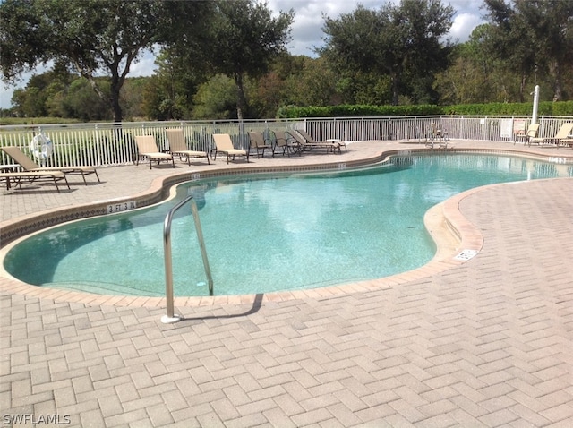 view of pool featuring a patio