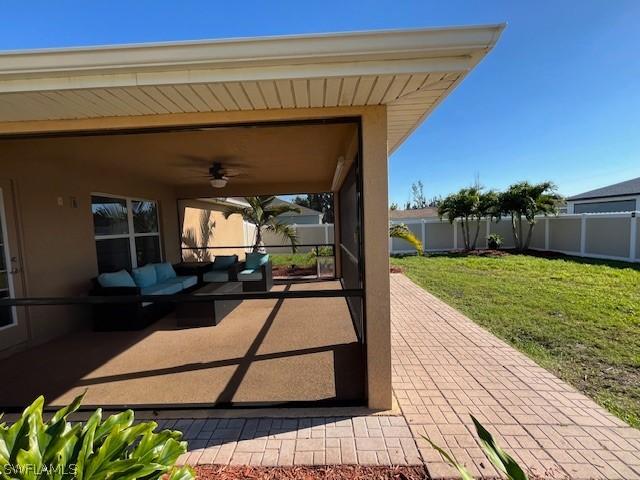 view of patio featuring outdoor lounge area and ceiling fan