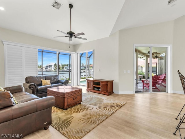 living room with ceiling fan and light hardwood / wood-style floors