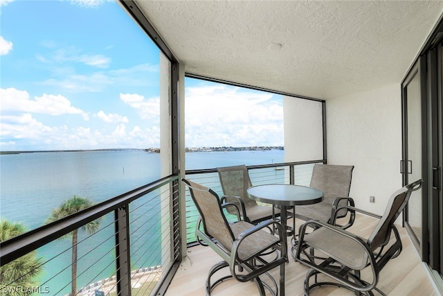 balcony featuring a water view