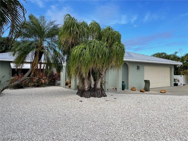 view of side of property featuring a garage