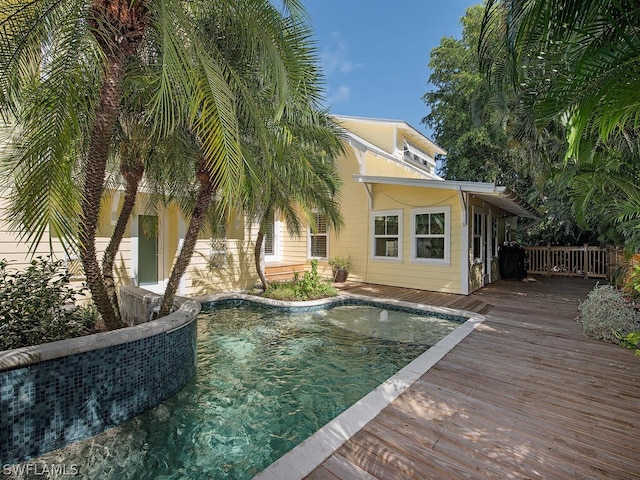 view of pool with a wooden deck