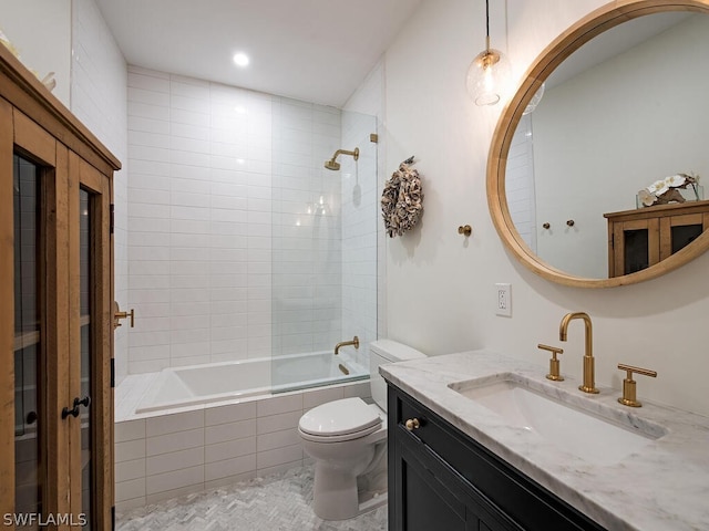 full bathroom with toilet, tile flooring, tiled shower / bath combo, and vanity