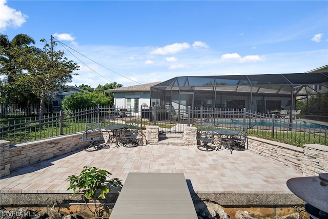 exterior space with a fenced in pool and a lanai