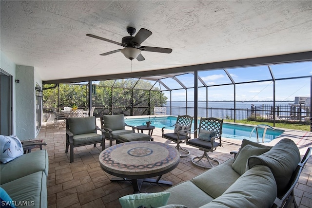 exterior space featuring ceiling fan and a healthy amount of sunlight